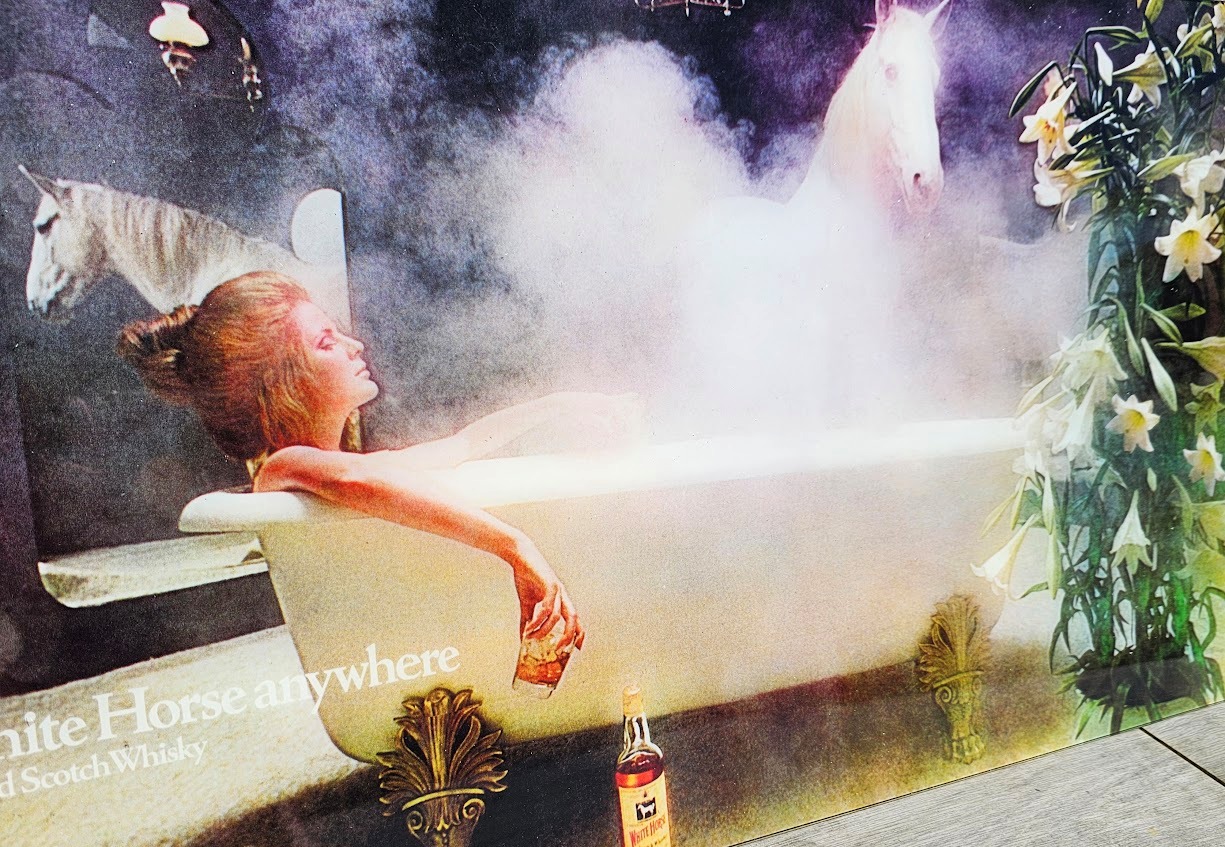 White Horse whisky you can take a white horse anywhere, advertisement from the seventies, girl in bath in colour by Michael Joseph