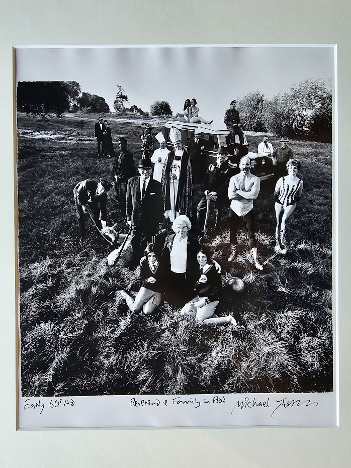 Reverend and family in field, a group of people in fancy dress in the middle of the countryside by Michael Joseph