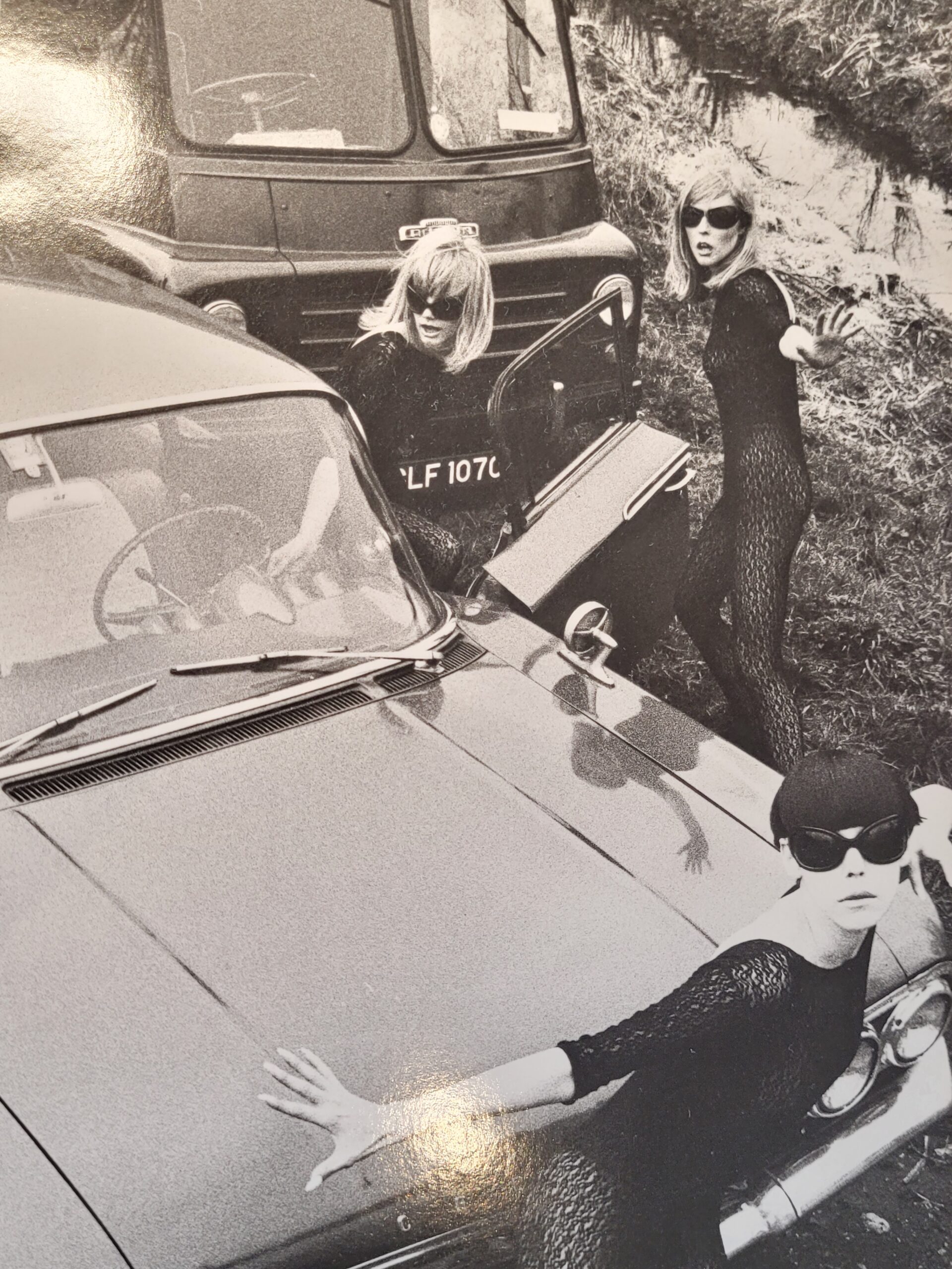 Acrilan sixties country road-block, rebellious sunglass-bearing gals and vehicles, by Michael Joseph