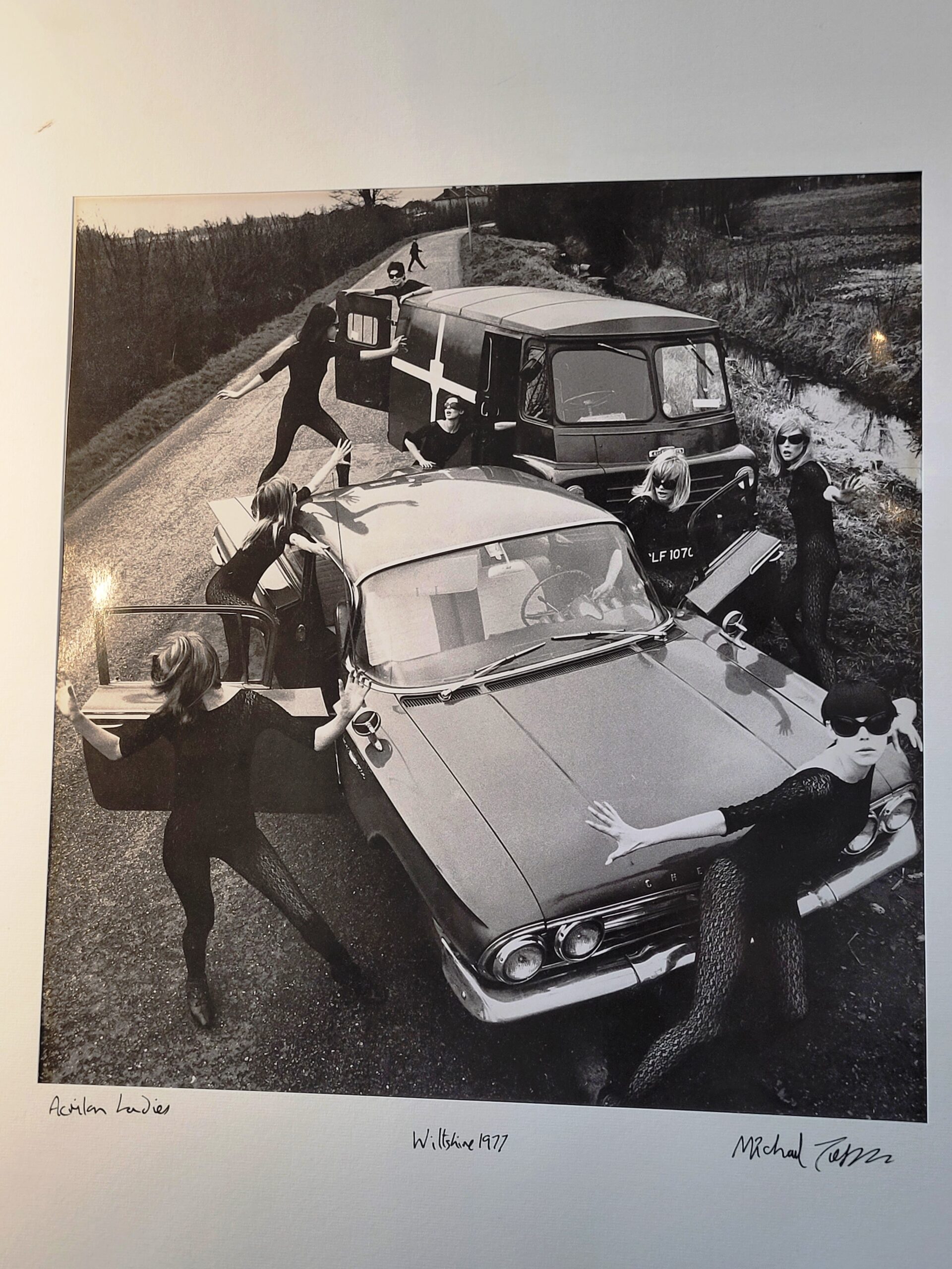 Acrilan sixties country road-block, rebellious sunglass-bearing gals and vehicles, by Michael Joseph
