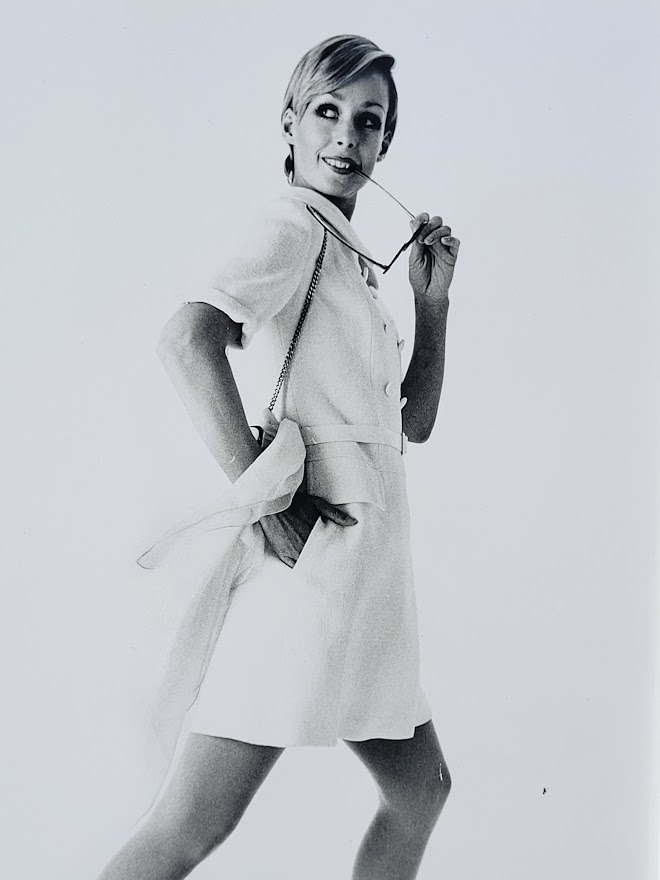 Pretty blonde model holding her glasses with her teeth, say oh really - only by Michael Joseph