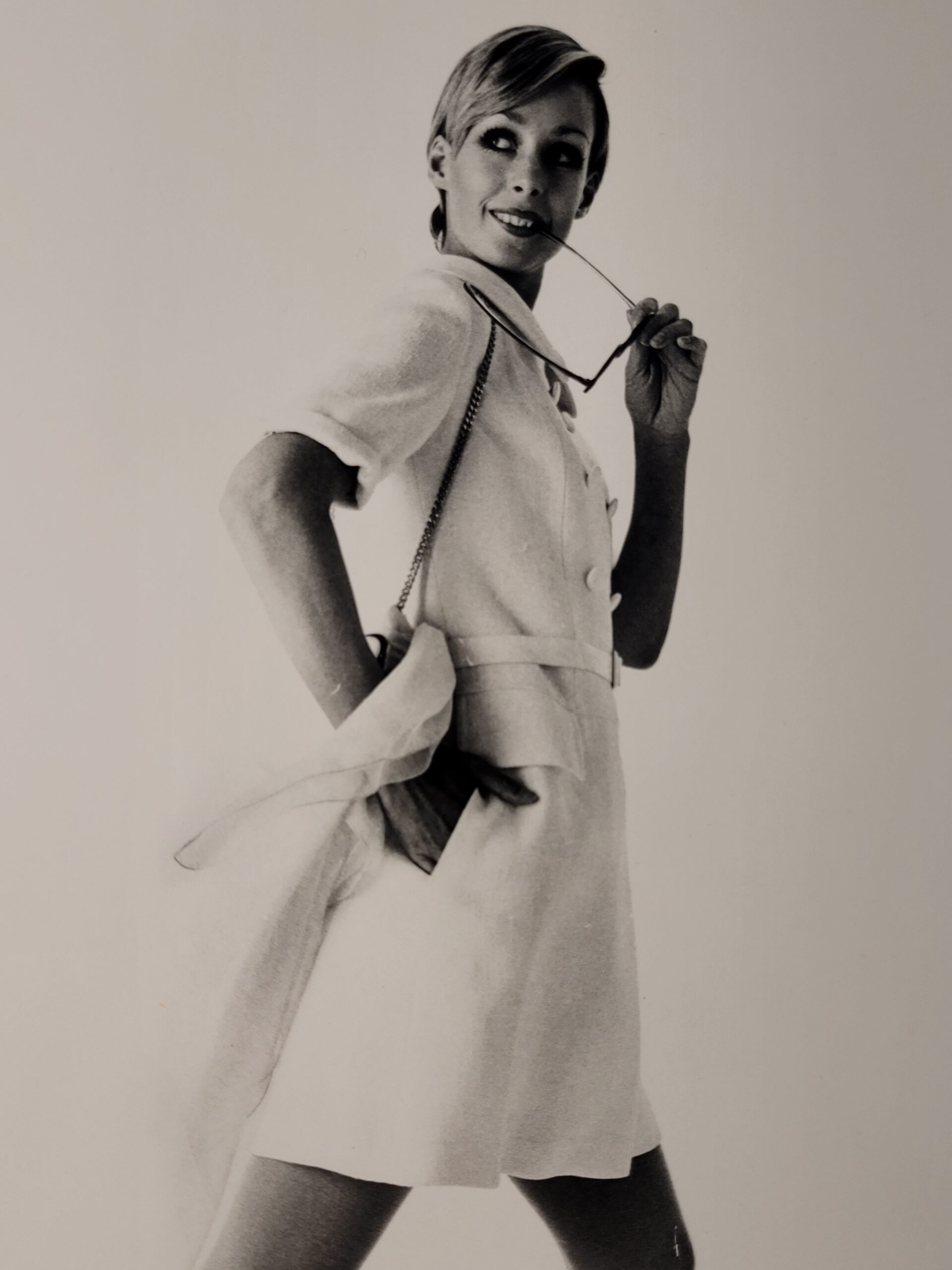 Pretty blonde model holding her glasses with her teeth, say oh really - only by Michael Joseph