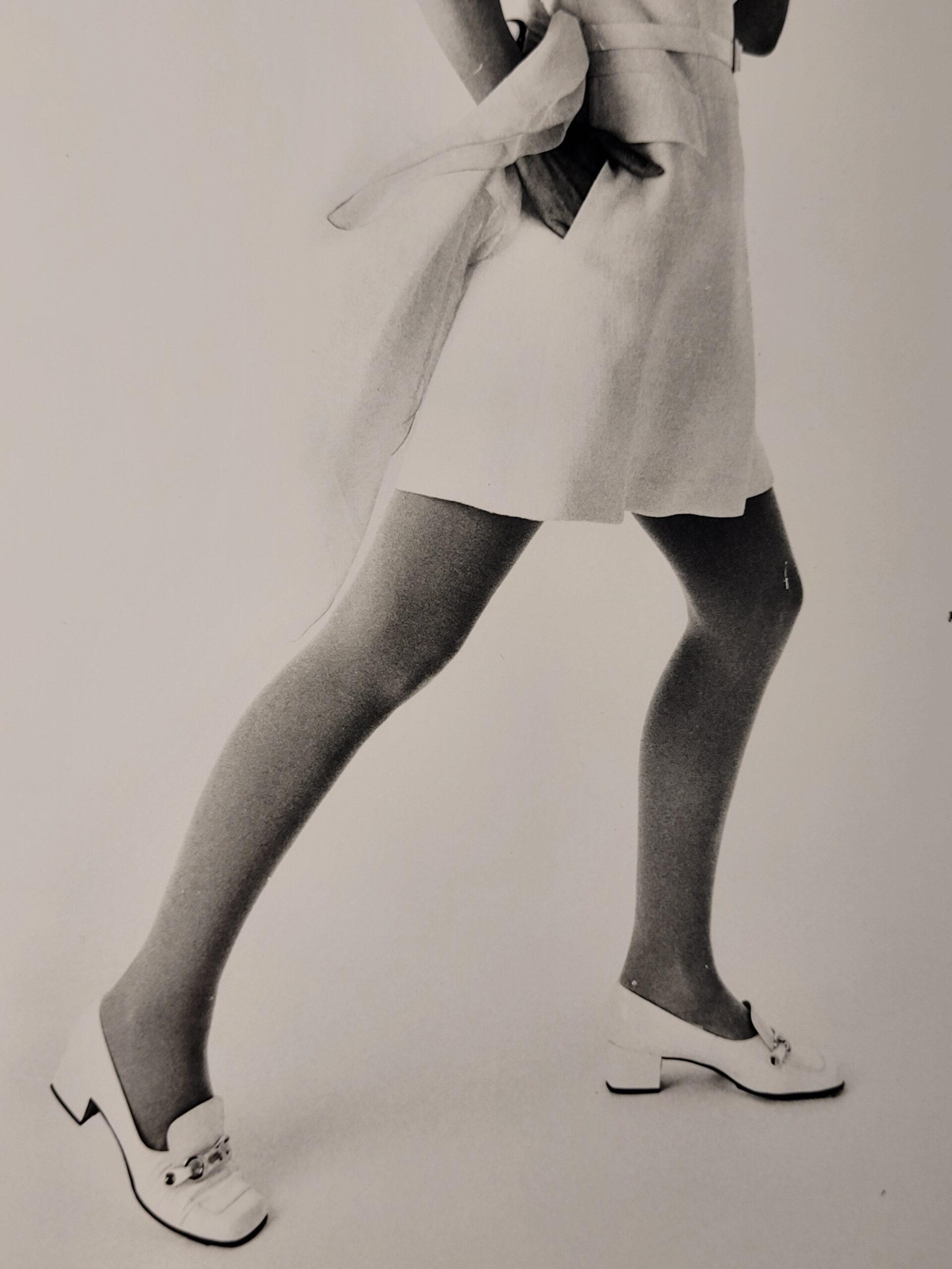 Pretty blonde model holding her glasses with her teeth, say oh really - only by Michael Joseph