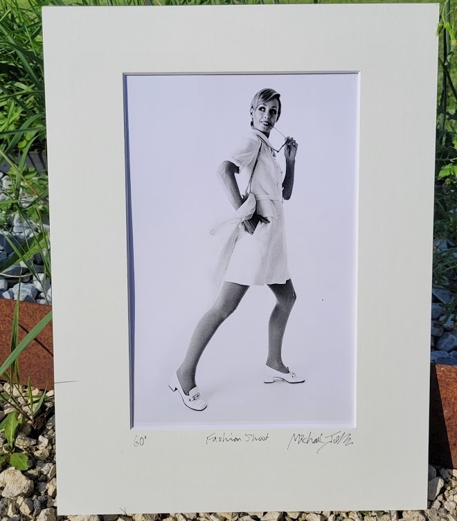 Pretty blonde model holding her glasses with her teeth, say oh really - only by Michael Joseph