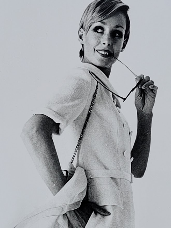 Pretty blonde model holding her glasses with her teeth, say oh really - only by Michael Joseph