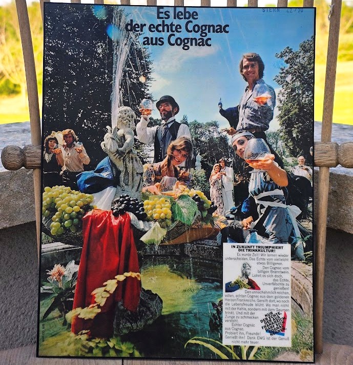 Fountain, grapes and happy people drinking Cognac - "Long live the real Cognac from Cognac" ad by Michael Joseph