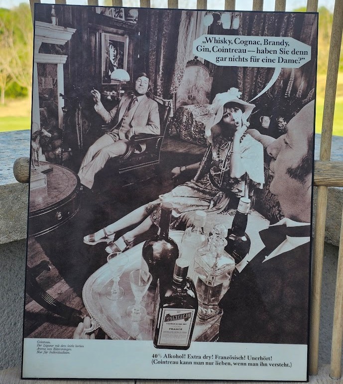 "Don't you have anything for a lady?" butler foreground, Mick Jagger background, Cointreau ad by Michael Joseph