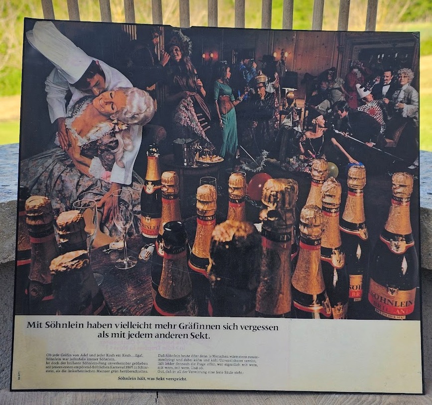 Sohnlein fancy dress party, drinking sparkling wine in wigs, a sixties advertisement by Michael Joseph