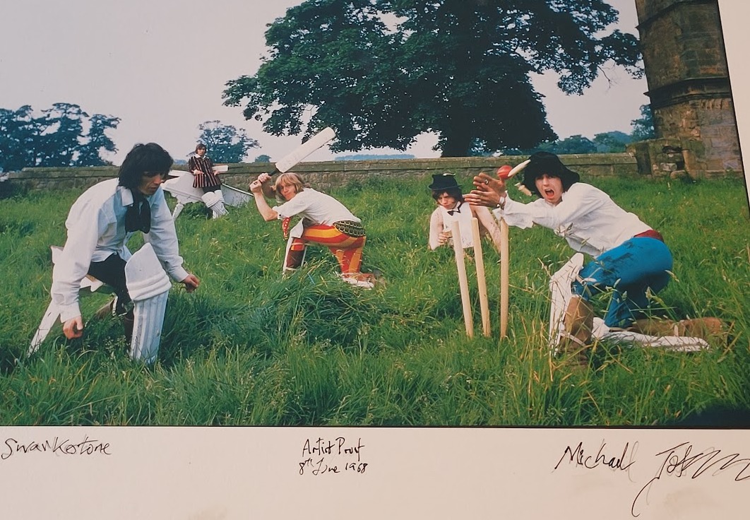 Rolling Stones playing cricket at Swarkestone, June 1968, a sporty Mick Jagger and colleagues in the grass by Michael Joseph