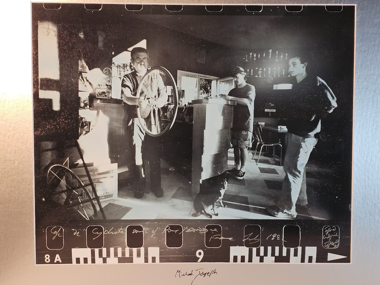 Cyclist's café with negative border, blue bromide authentic darkroom print by Michael Joseph